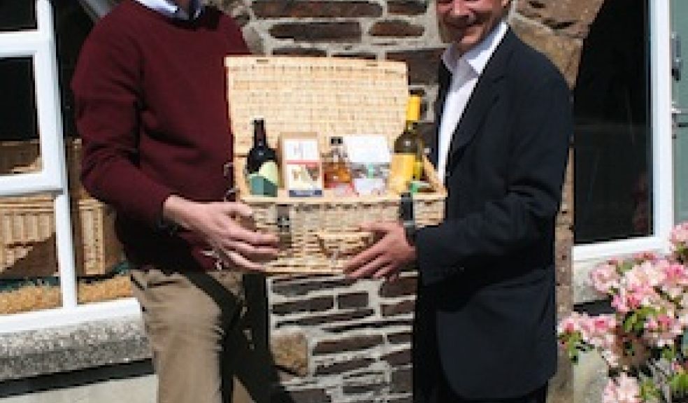 Adam Fox-Edwards of Devon Hampers with Exeter Racecourse's general manager Tim Darby