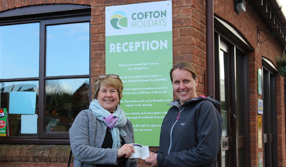 Jan Coman, Devon Wildlife Trust Fundraising Team, receiving a cheque for £430 from Mellony Kirby, Director Cofton Holidays, bringing the total raised for charities by Cofton to over £2,000 in the last year.