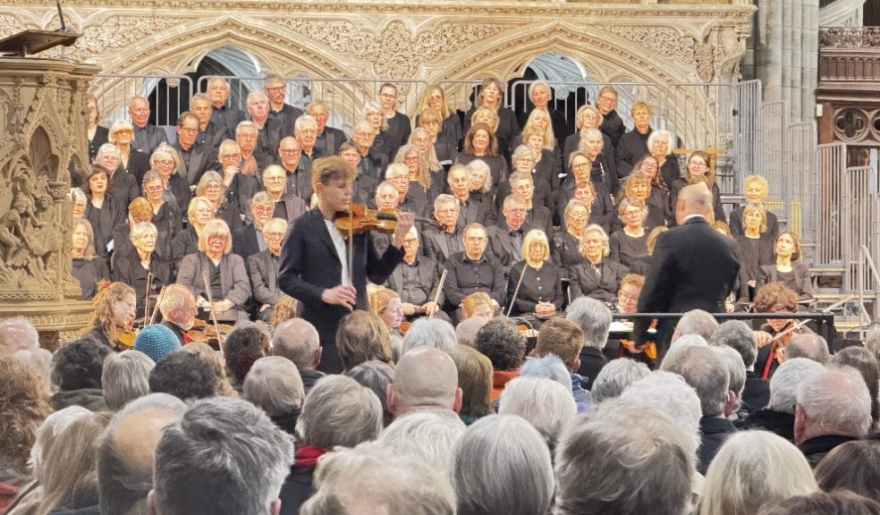 Devon-born violinist Joel Munday performing with Exeter Philharmonic Choir at the concert. Photo by Sharon Goble.