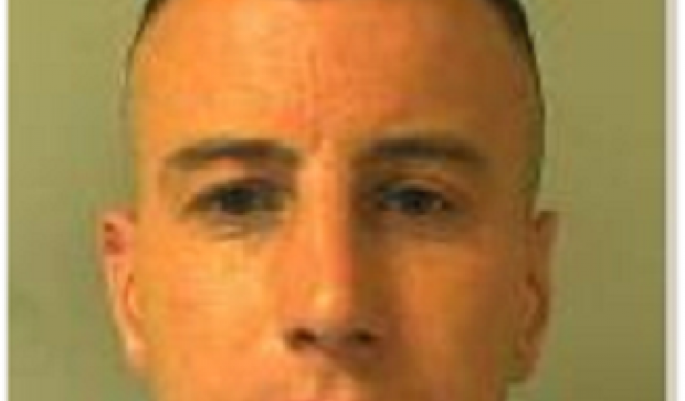 Dean Smart, 27 is wanted in connection to a robbery in Dawlish last year