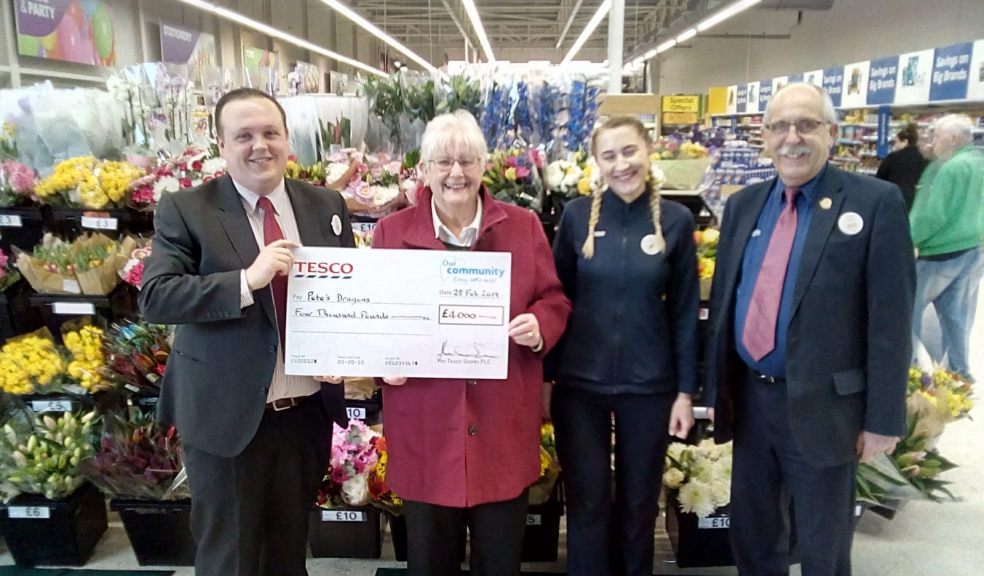 Dan Salisbury, customer service manager at the Exeter Vale Tesco Extra, presents a cheque for £4,000 to Pete’s Dragons chair of trustees Janet Ash. Also pictured are Tesco’s Marta Marsweska and John Smith.