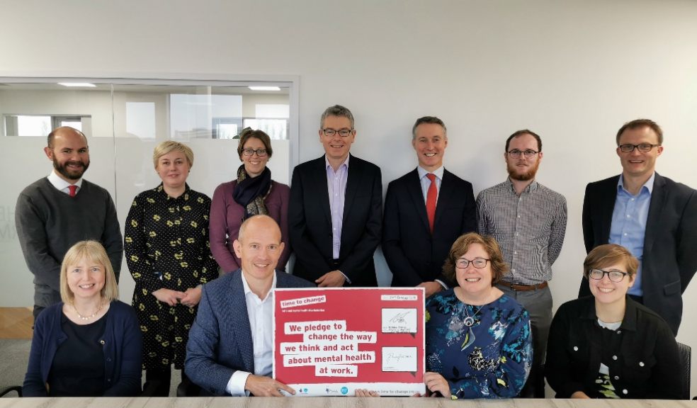 Fisher German Managing Partner Andrew Bridge (front centre) and colleagues when the firm signed the Time to Change pledge, committing to help change the way people think and act about mental health in the workplace (photo taken pre-Covid).
