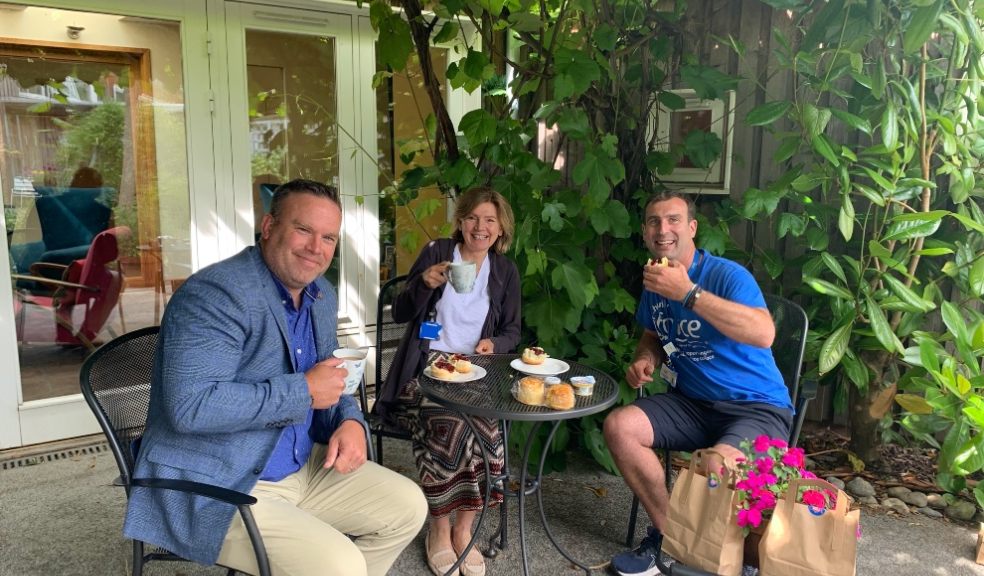 From L-R David Matthews, Development Director for Barratt David Wilson Homes Exeter having afternoon tea with Olly Watts and Sally Hoult from FORCE cancer charity.