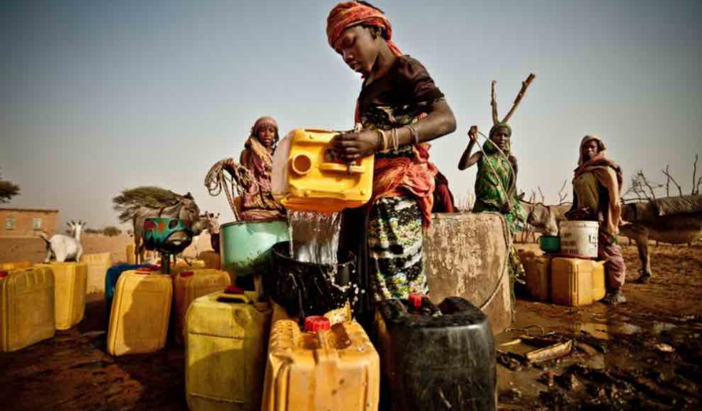 Fari Awade draws water from a well in the community of Natriguel, Mauritania. Climate-related hazards, such as droughts, can cause economic shocks to agricultural communities, which may heighten the risk of armed conflict, according to a new study including Prof neil Adger from the University of Exeter