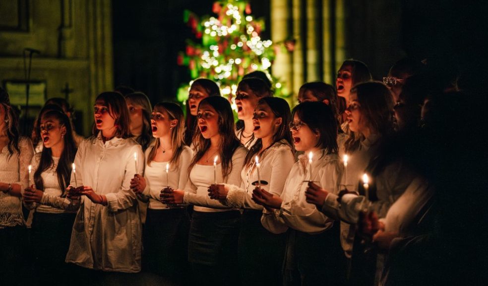 Students singing Betelehemu - a Nigerian Christmas carol, by candlelight.