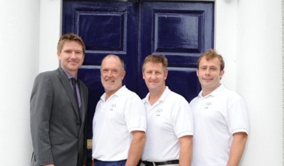 Paul Carnell of Thompson Jenner with the team from Fairfield House Dental Surgery