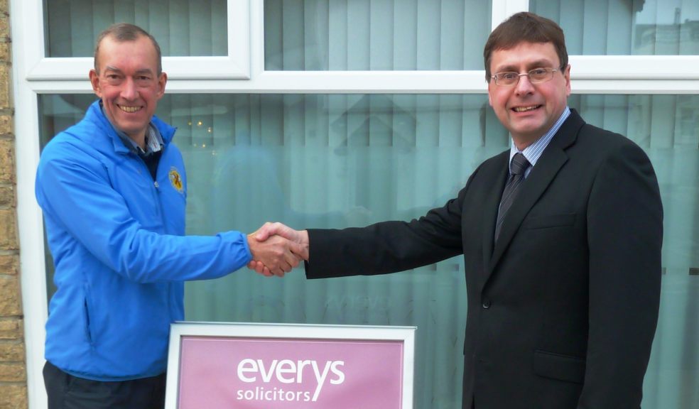 Race director Dave Thomas shakes on sponsorship deal with Everys partner Richard Stokes.