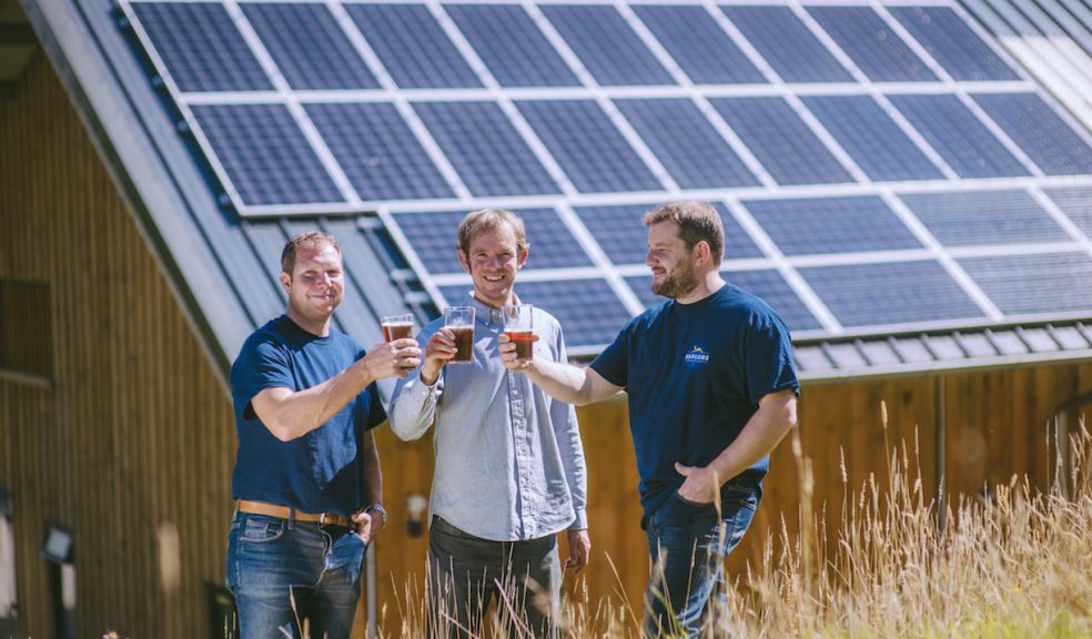 Hanlons Directors Jim BunGard (Left) and Dan Taylor (right) toast their new solar panels with SunGift director Gabriel Wondrausch (centre)