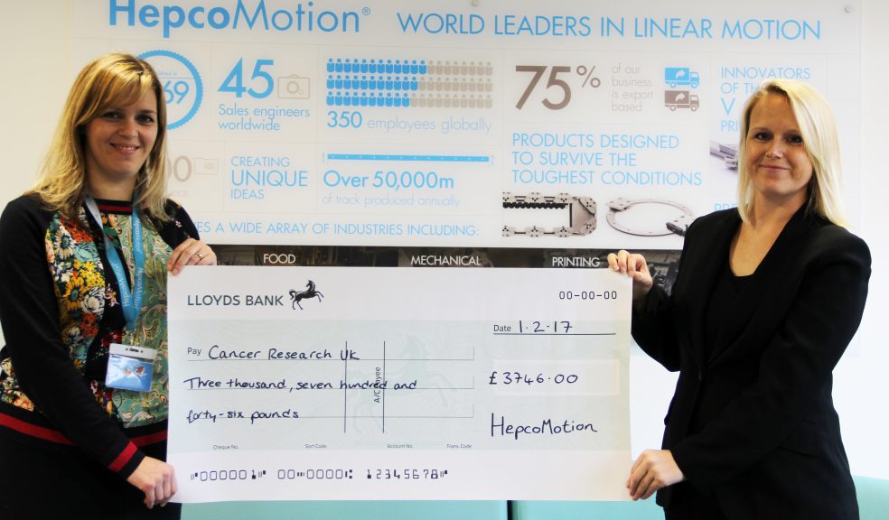 Tanya Frost, Public Relations Officer at HepcoMotion, presents a cheque for £3746 to Rachel Turner, Local Fundraising Manager for Cancer Research UK.