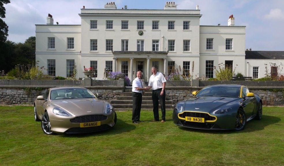 Pictured above Steve Robinson (Grange Aston Martin) and Mark Crouch (winner of the hole in one prize) at Exeter Golf and Country Club.