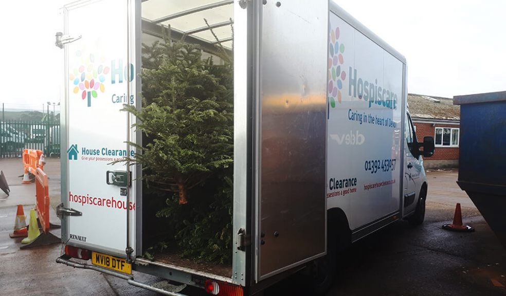 Hospiscare van being loaded with Christmas Trees 