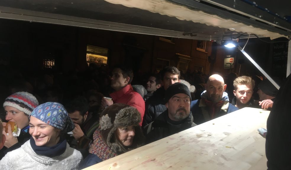 Hungry crowds at the feasting wagon