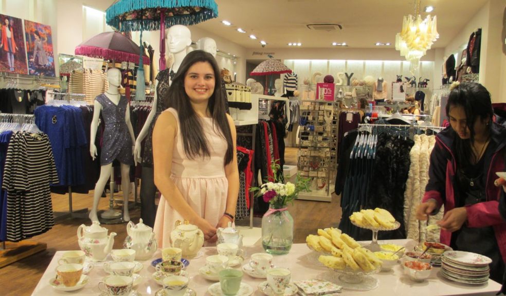 Alara Guven welcomed customers with a smile, a teacup of Champagne and scones cream and jam