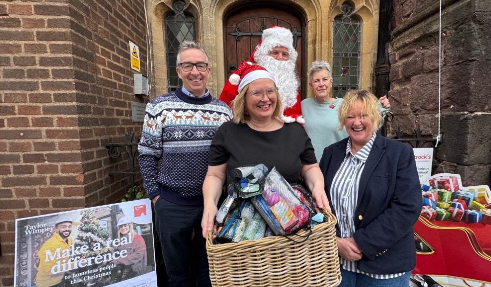 Taylor Wimpey Exeter staff with donated washbags.