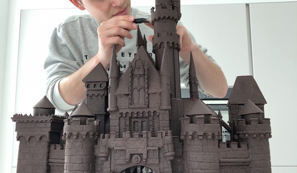 Kieran Charles putting the finishing touches to his chocolate castle