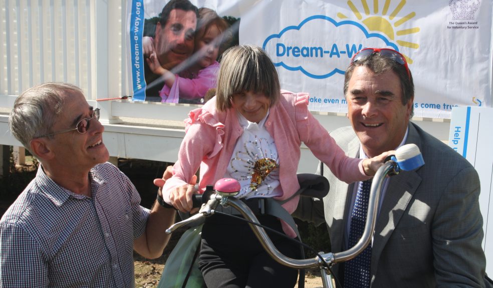 Katie with her Guinness carer, Aubone; Katie; and Nigel Mansell CBE