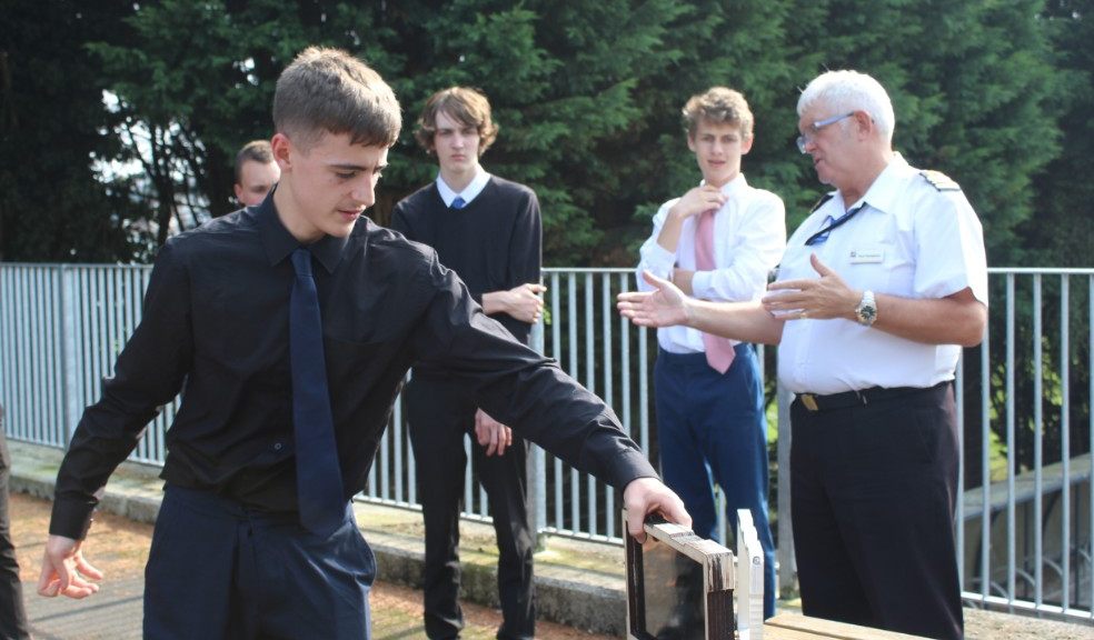 Midshipman Ben Grant, Joshua Parr (17), Tyler Edmond (18), Toby Coniam (17) with Chris West present their project