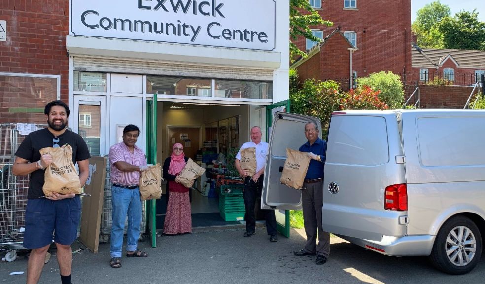 Inclusive Exeter volunteers unloading a food delivery. Photo: Alan Quick. Inclusive Exeter, Fairshare