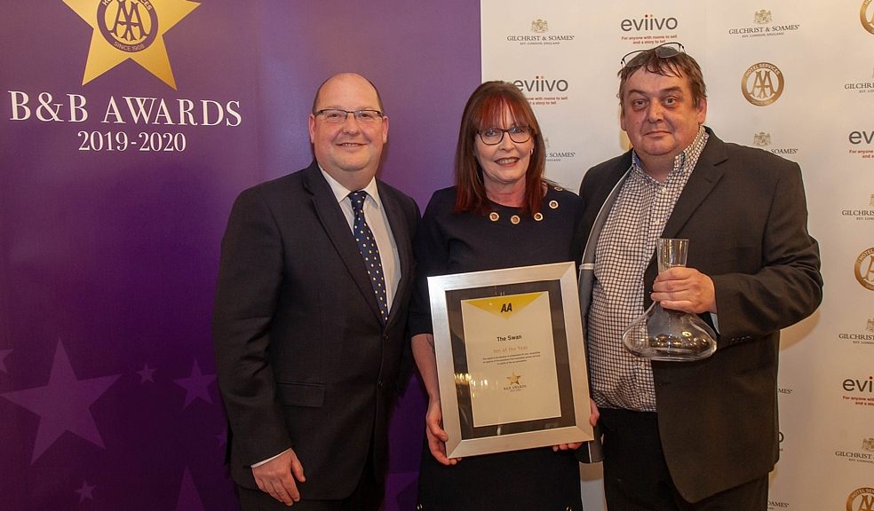 Paul and Donna Berry of the award-winning Swan in Bampton, which has won the AA’s ‘Inn of the Year’ award 2019-20, receiving their award from Paul Hackett Senior Inspector from the AA (left).