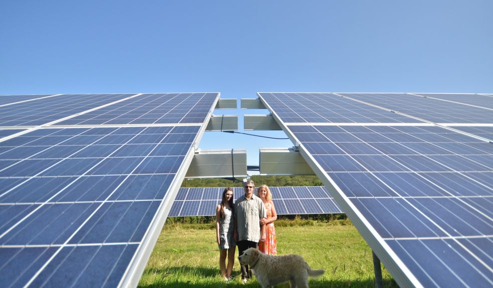 The Ballard family with their 61 kW ground-mounted solar PV system, designed and installed by local company SunGift Energy