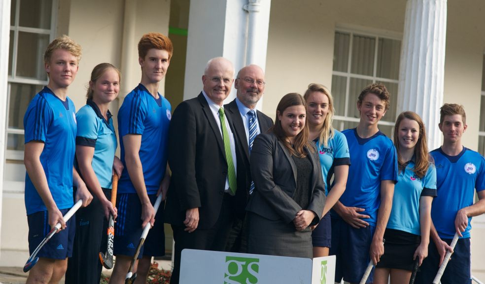 Kim Mcdonald (centre), Philip Luckham (left) and Alistair Heron (right) of Gilbert Stephens LLP with members of the England U18 Futures Cup training squad and members of the girls hockey team