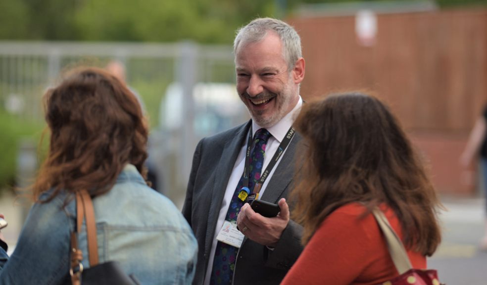 Principal John Laramy celebrates with Exeter College students