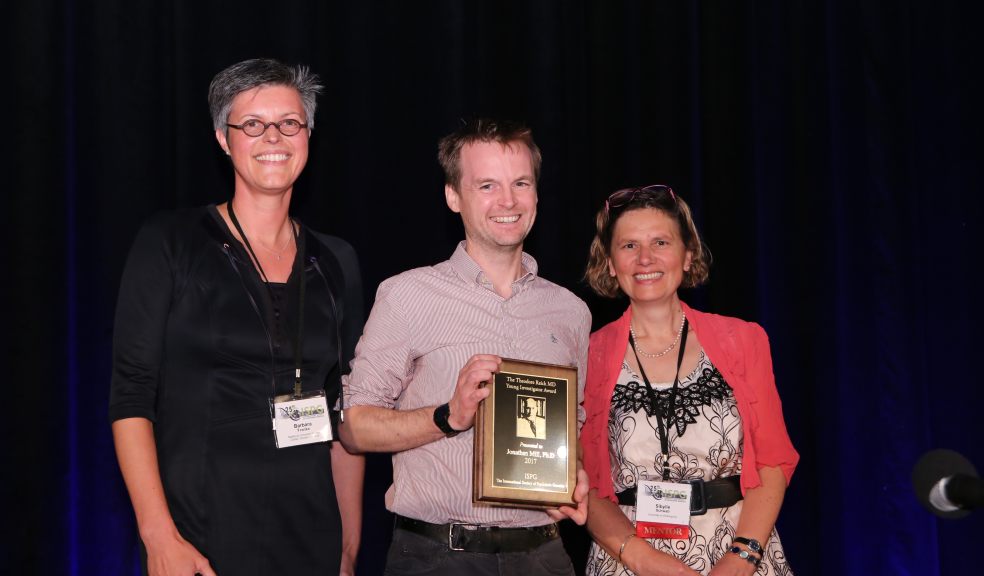 Professor Jonathan Mill being presented with his award