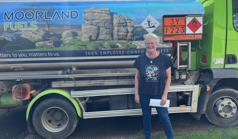 Woman stood in front of Moorland Fuels Tanker