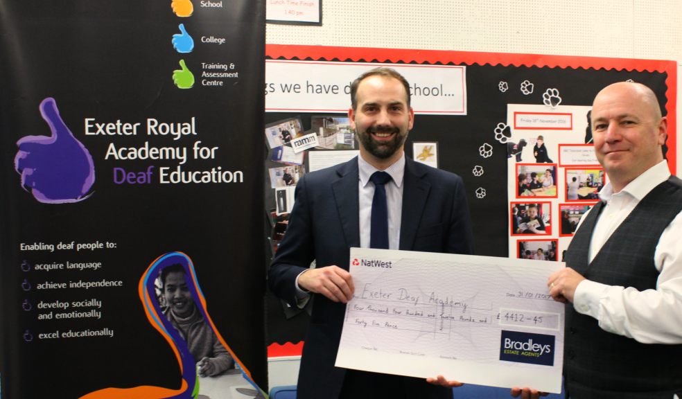 Kai Logan presenting Bradleys cheque to Steve Morton