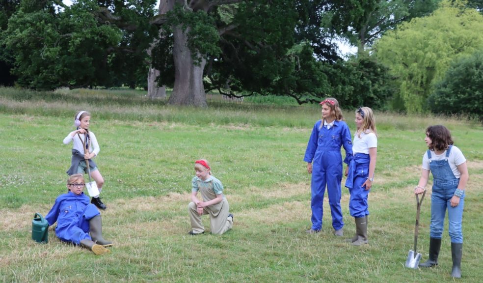 Children dressed as Land Girls in the grounds of Killerton House