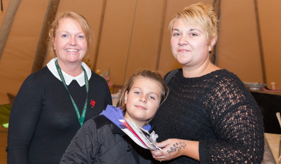 Competition winner Claire Geisler, with daughter Ruby and Trish Harrogate, Devon Registration Service Manager