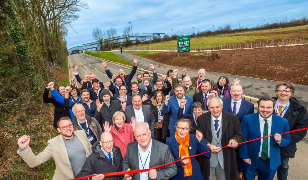 EDDC Leader Cllr Paul Arnott cuts a ribbon to open Long Lane, together with representatives from Devon County Council, the South West Local Enterprise Partnership, East Devon District Council, Simon Jupp MP, Exeter College, Exeter Airport, contractors and local VIPs. Photo credit: GRW Photography