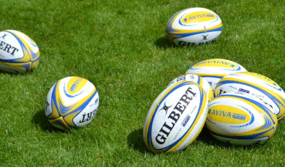 The community spirit of rugby Rugby balls in a field