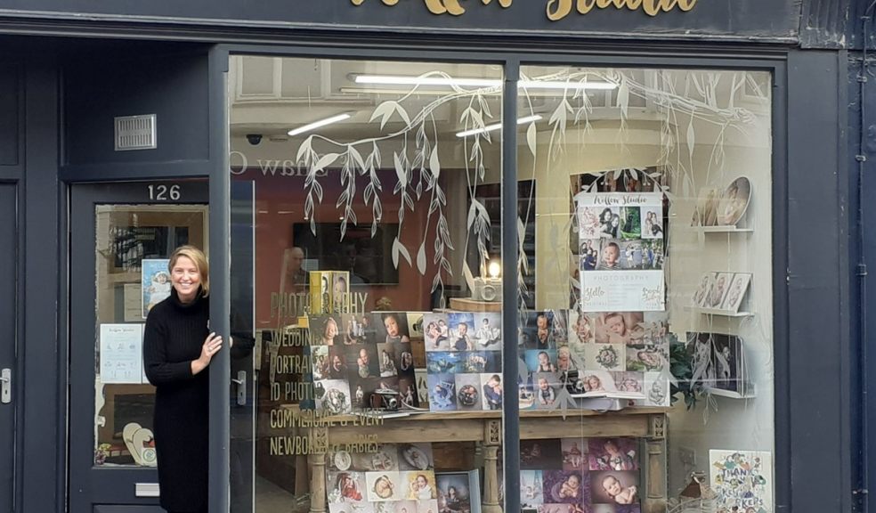 woman standing outside shop