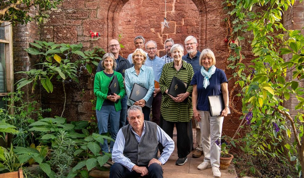 Compere, well-known historian Dr Todd Gray, with some of the choir's members