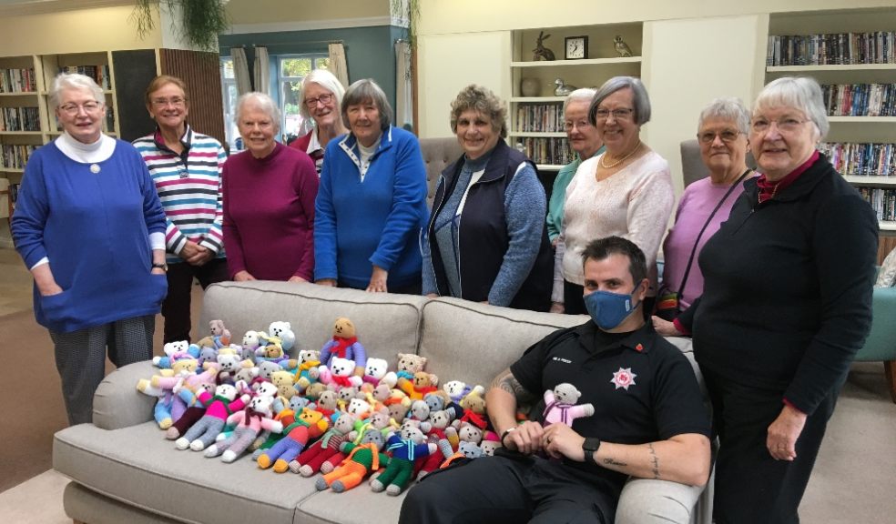 Millbrook residents with firefighter Sean Avery and the teddies