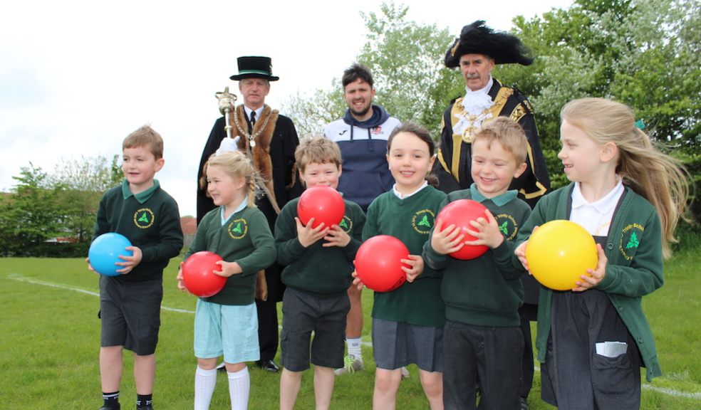 Children from Trinity C of E Primary School are pictured with (L-R) Senior Mace Sergeant John Davies; Dominic Goodhew, CITY Community Trust PL Primary Stars coach; and the new Lord Mayor of Exeter Cllr Peter Holland