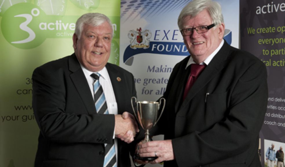 Outstanding Contribution to Sport winner Neil Parsons receiving trophy from category sponsor Tony Rowe OBE
