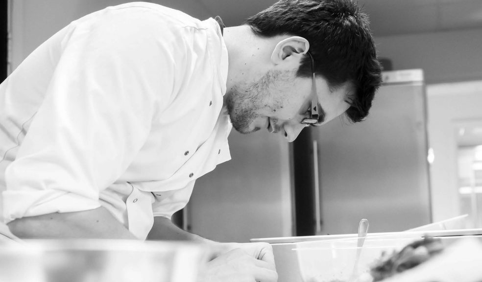 Worker in Paramount kitchen preparing food