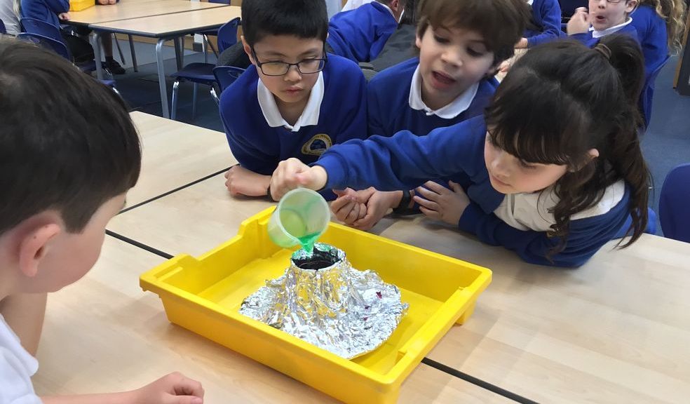 Children from the school experimenting with a foil 'volcano'