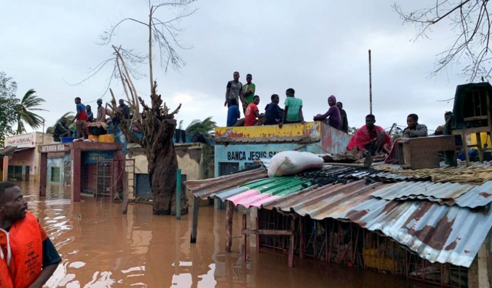 People sheltering on rooves of building in Buzi district Mozambique  