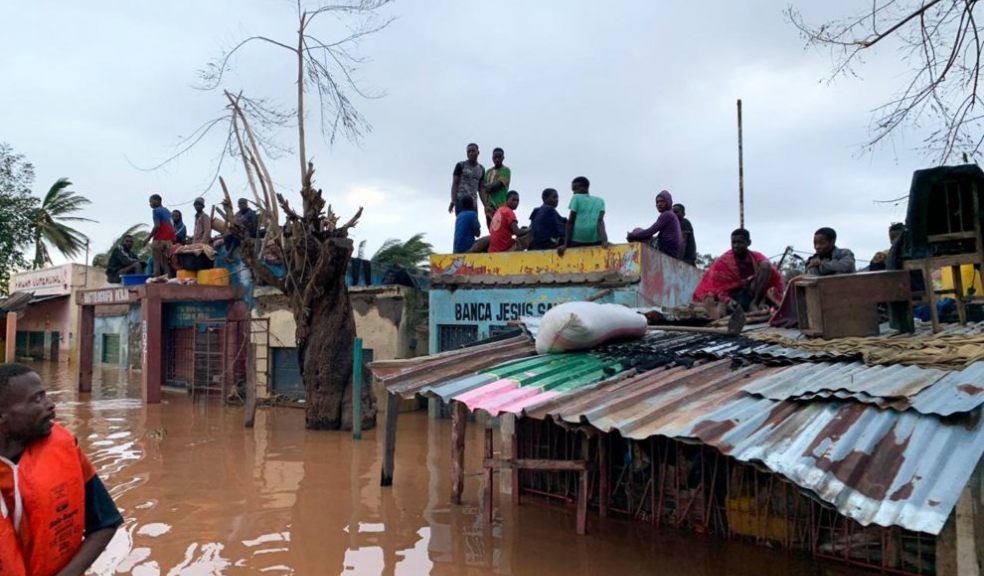 People sheltering on rooves of building in Buzi district Mozambique