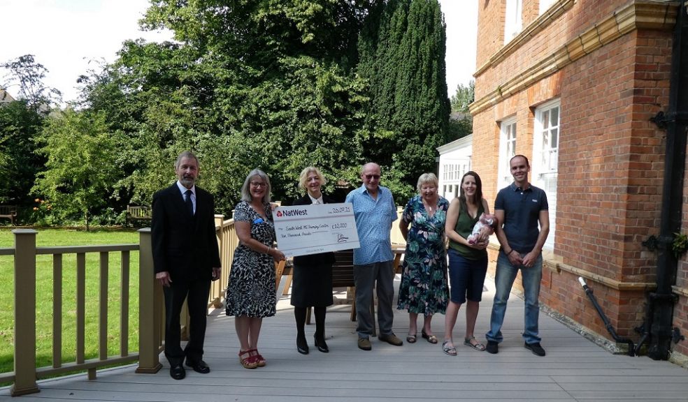 presentation of ten thousand pound cheque by east devon crematorium at south west ms centre