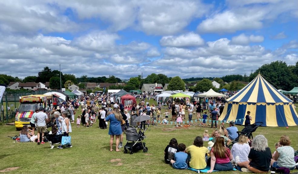 Image of visitors enjoying an outdoor summer community event. 