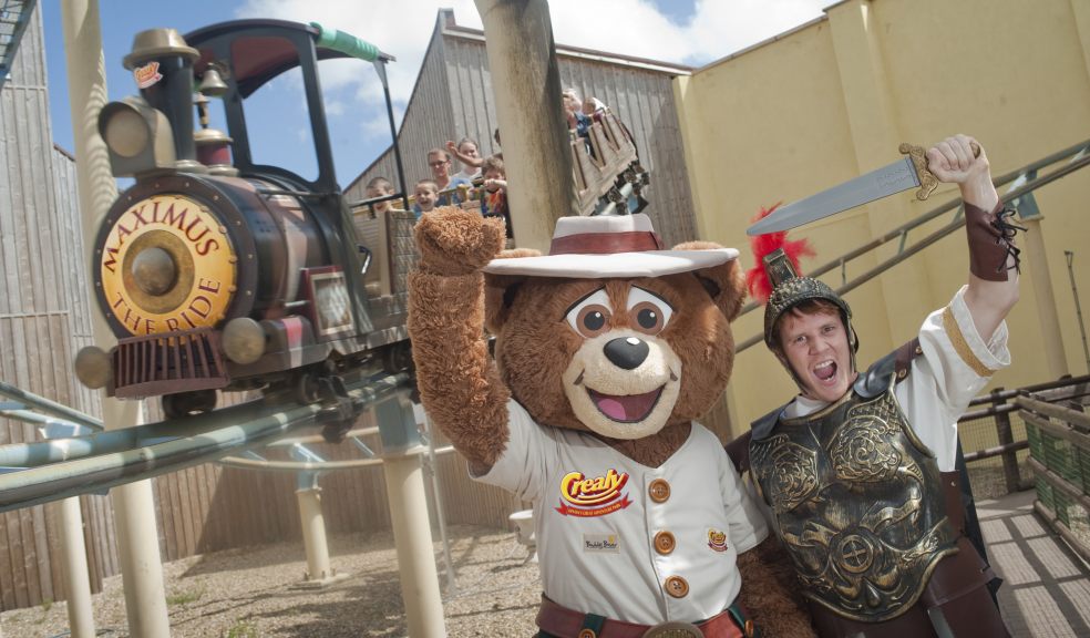 Centurion Crealious Maximus, joined by Crealy's mascot Buddy Bear, celebrate National Rollercoaster Day at the Maximus the Roman Rollercoaster ride