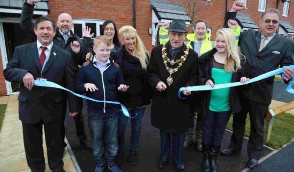 Mayor of Poole Councillor Peter Adams cuts a ribbon to officially open the development