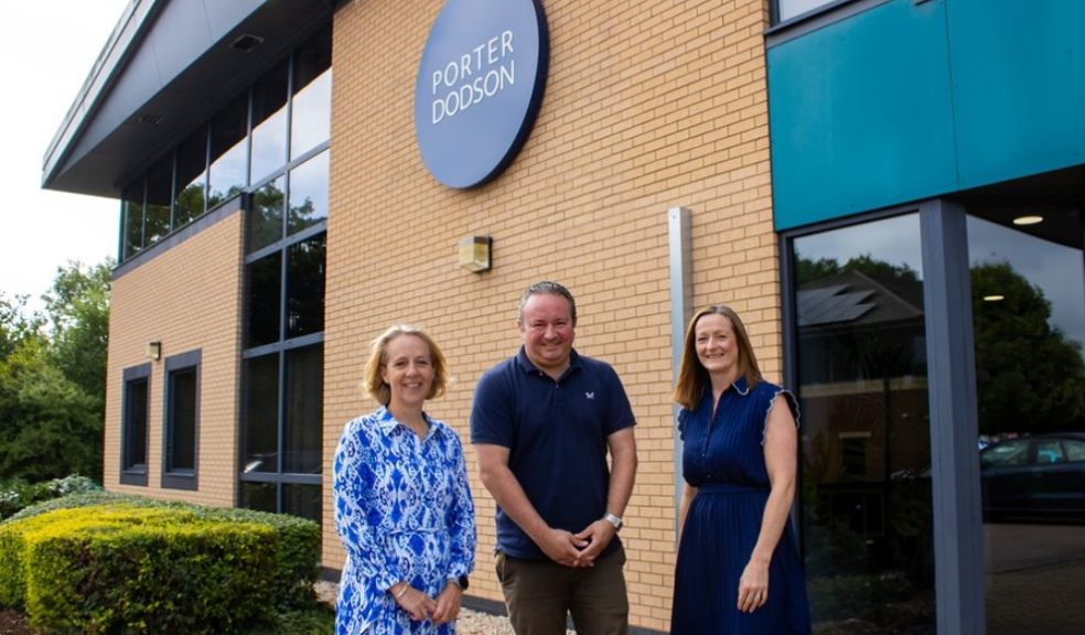 Porter Dodson achieves record breaking results Owners of Porter Dodson stood in front of building