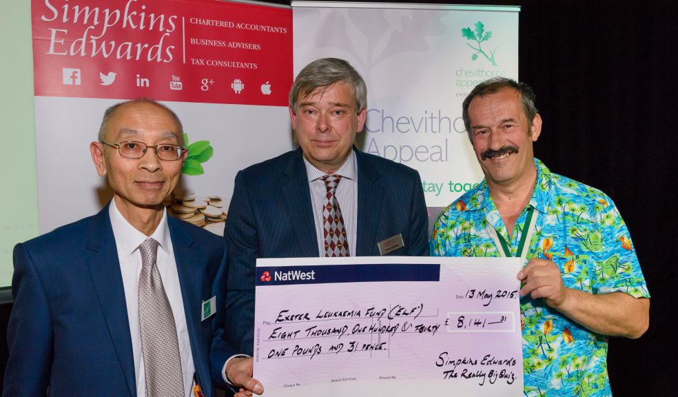 Simpkins Edwards' John Coombs and Lord Mayor Coucillor Percy Prowse present the Really Big Quiz cheque to Dr Richard Lee, Trustee for Exeter Leukaemia Fund