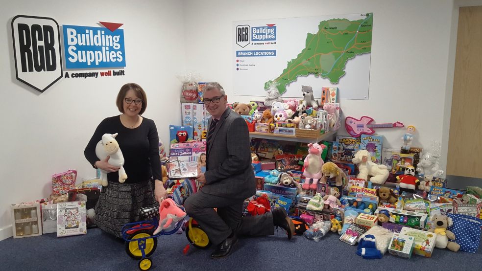 Naomi Dymond, Corporate Partnerships Fundraiser at Children’s Hospice South West and Kevin Fenlon, CEO at RGB Building Supplies with the gift donations.