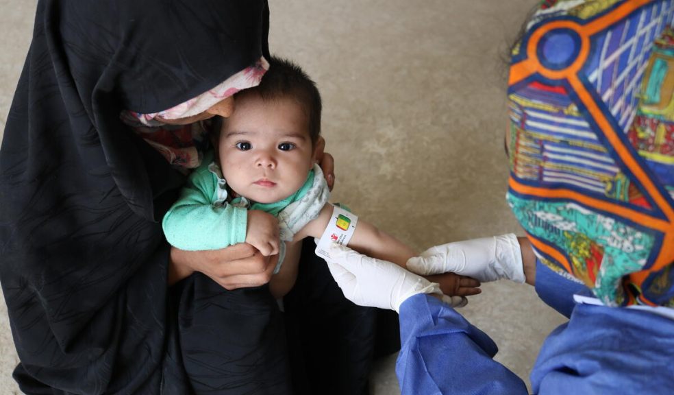 A health worker from the Save The Children mobile health team uses a MUAC band to measure the Aalem's arm circumference during a screening for malnutrition in Balkh province. Image: Save The Children